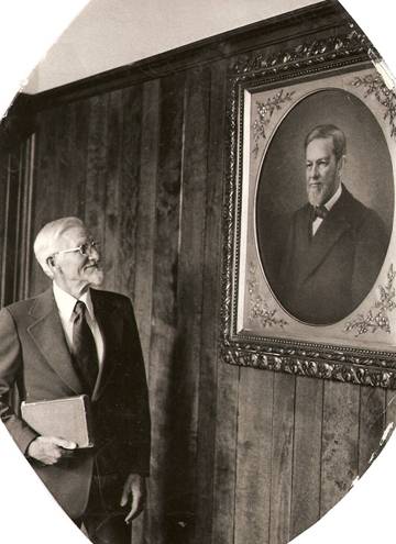 Doctor Broadus Keele, Sr. looking at picture of Dr. John Albert Broadus (Circa 1975, Southern Baptist Theological Seminary, Louisville, KY)